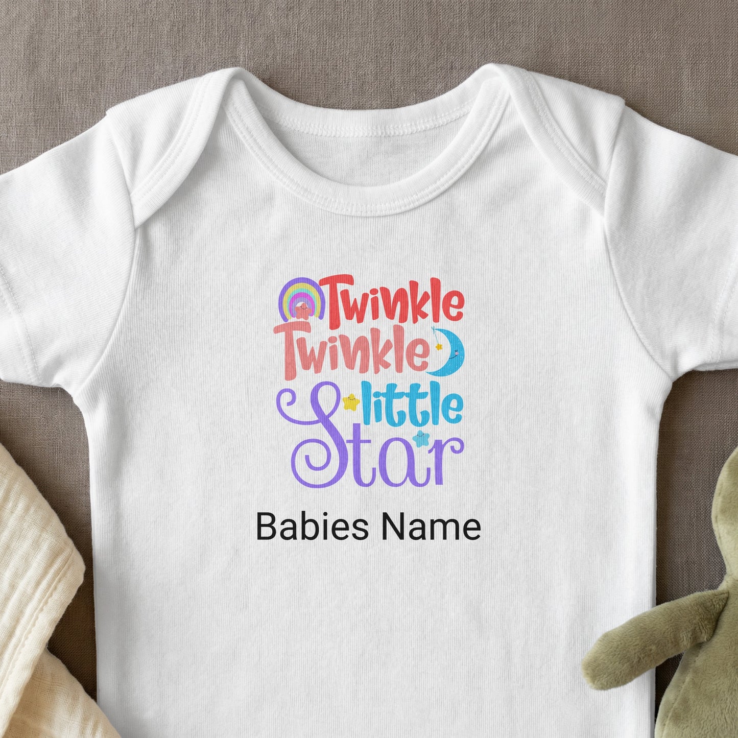 White baby onesie with "Twinkle Little Star" and "Babies Name" text.