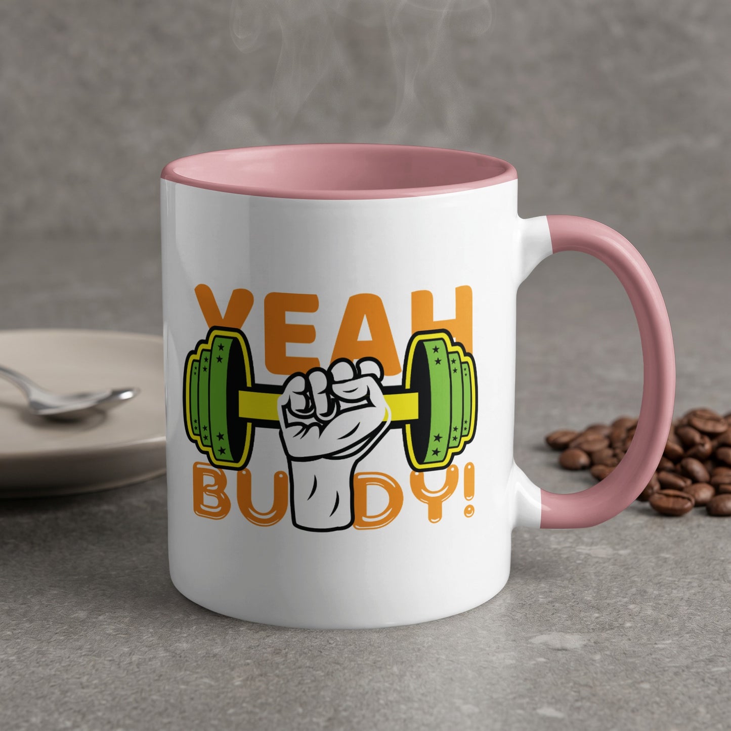Mug with "YEAH BUDDY!" text and a dumbbell graphic, pink rim.