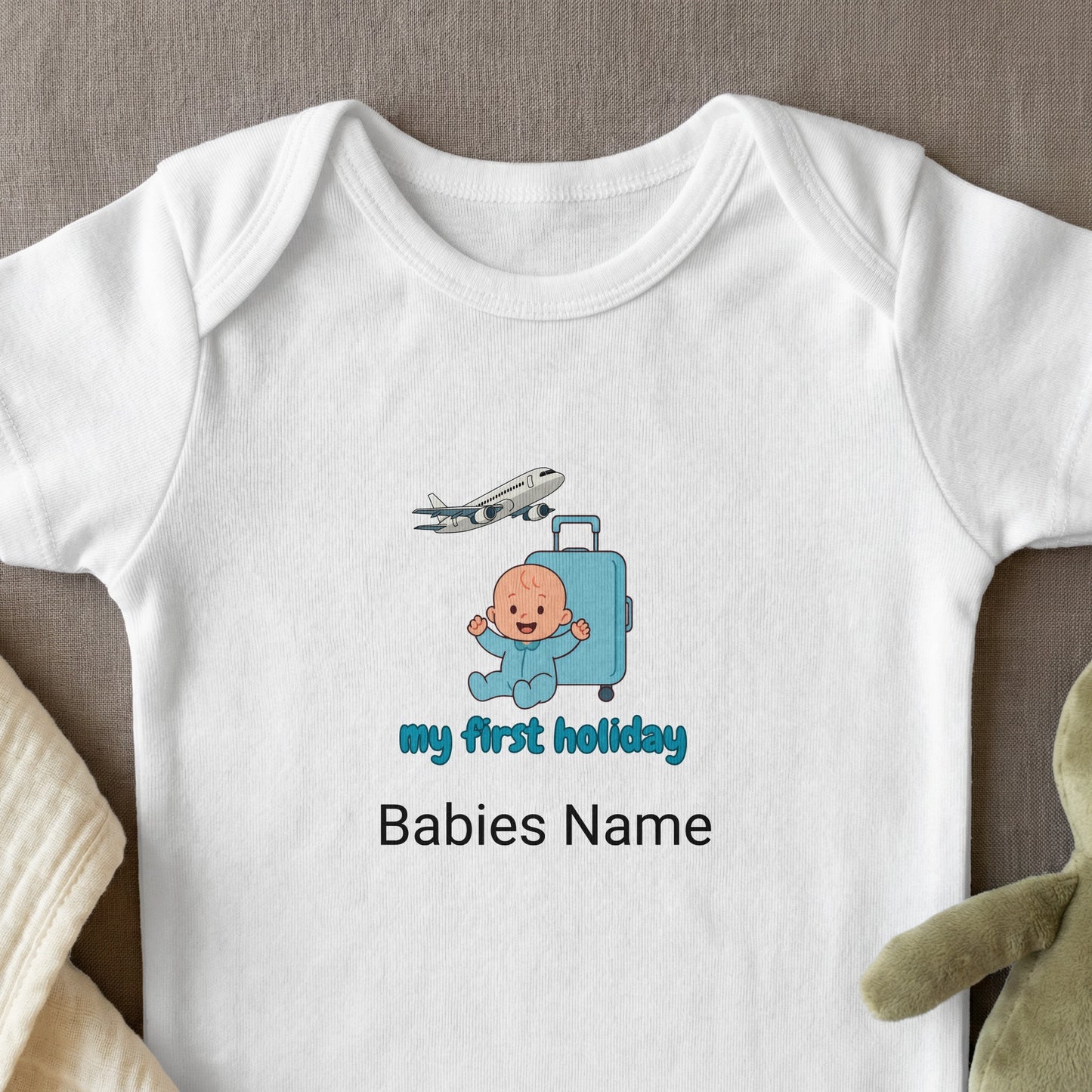 Baby's first holiday text on white baby onesie with airplane and suitcase.
