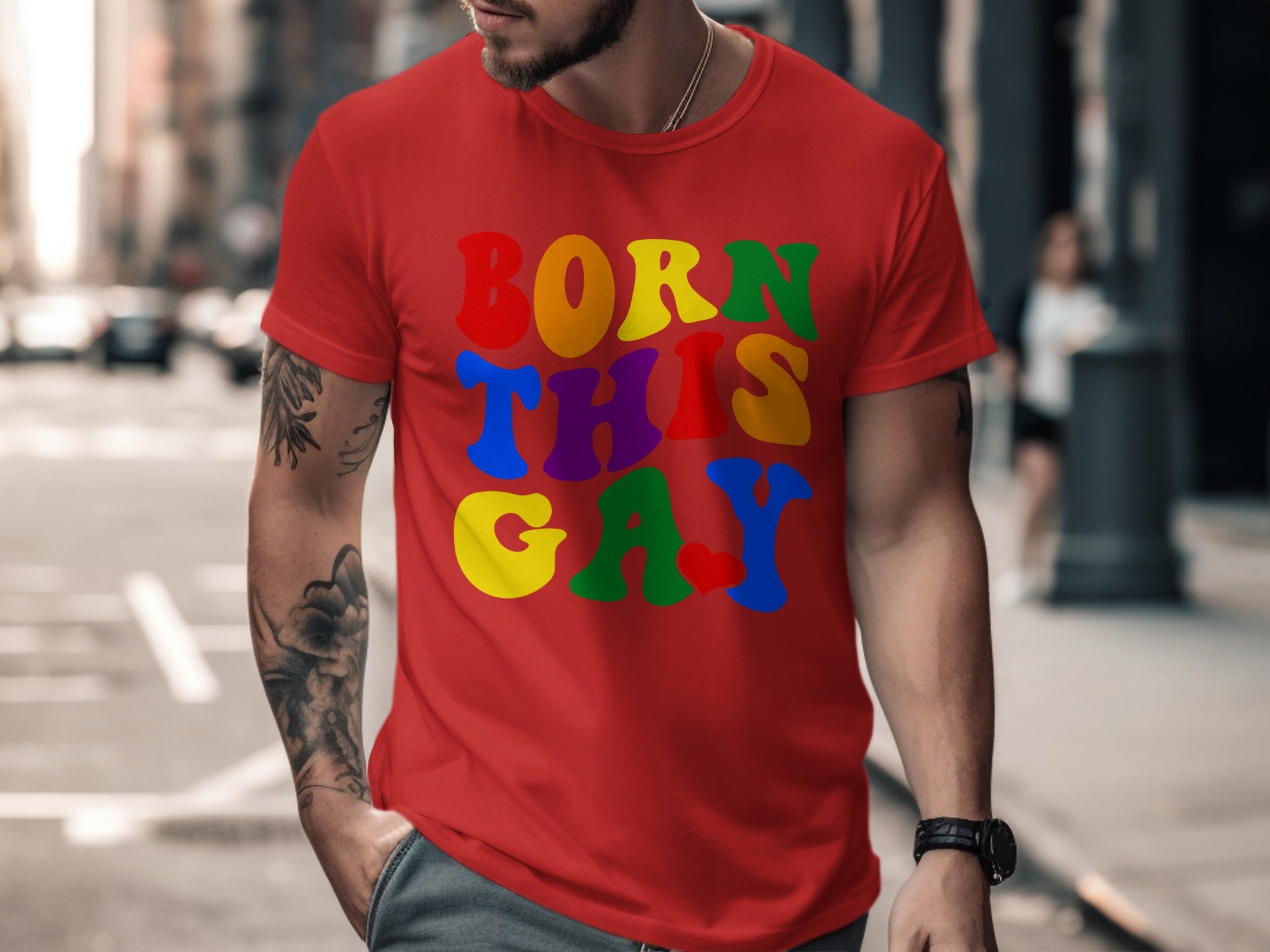 Red t-shirt with rainbow text "BORN THIS GAY" and a heart.
