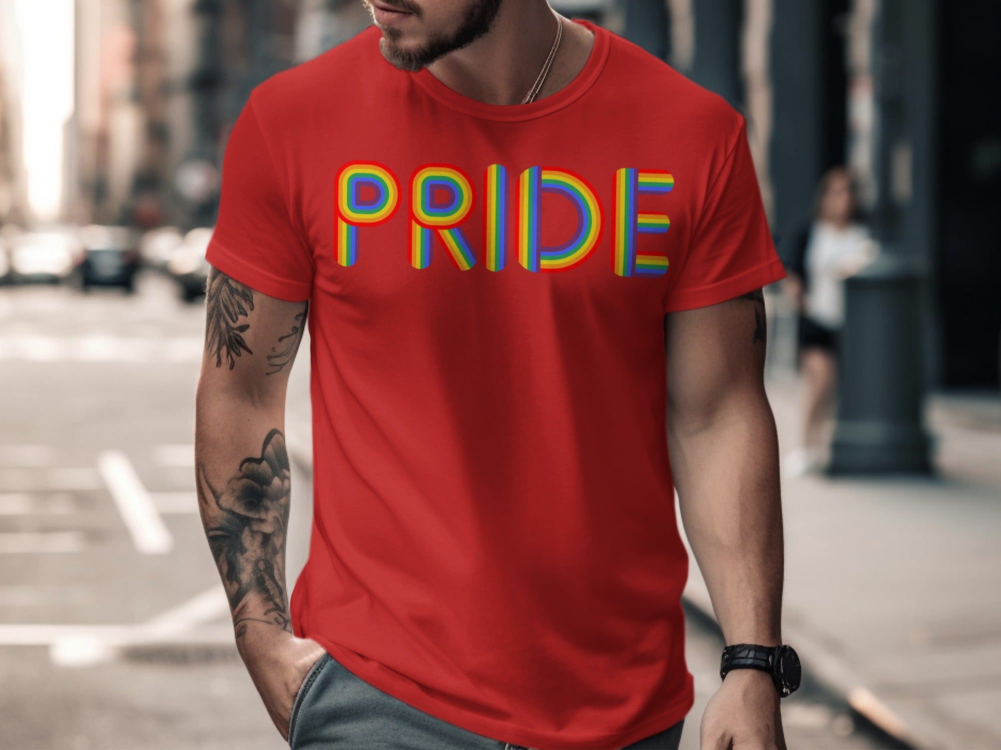 Red t-shirt with rainbow "PRIDE" lettering and tattooed arm.