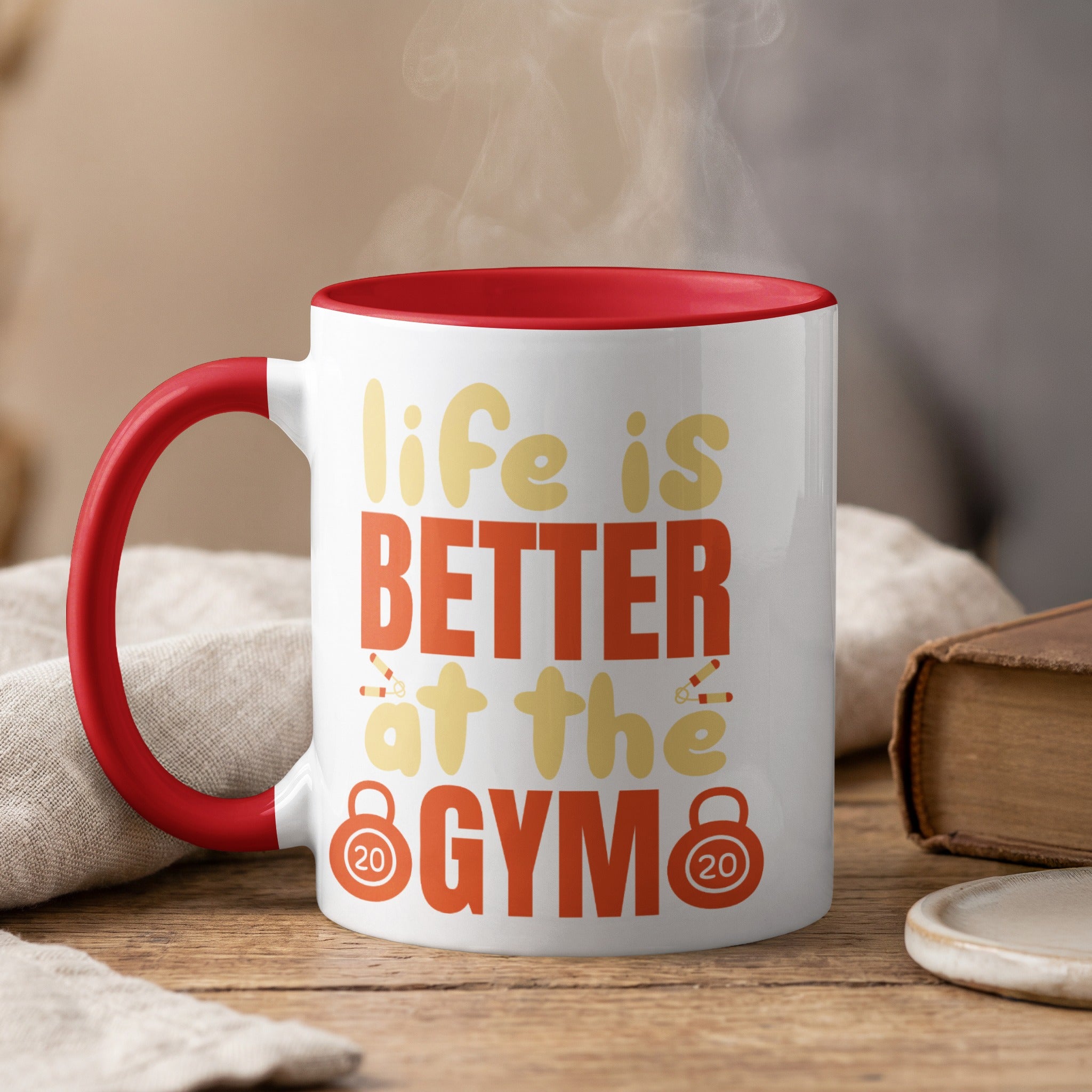 White mug with red rim, featuring text "life is BETTER at the GYM".