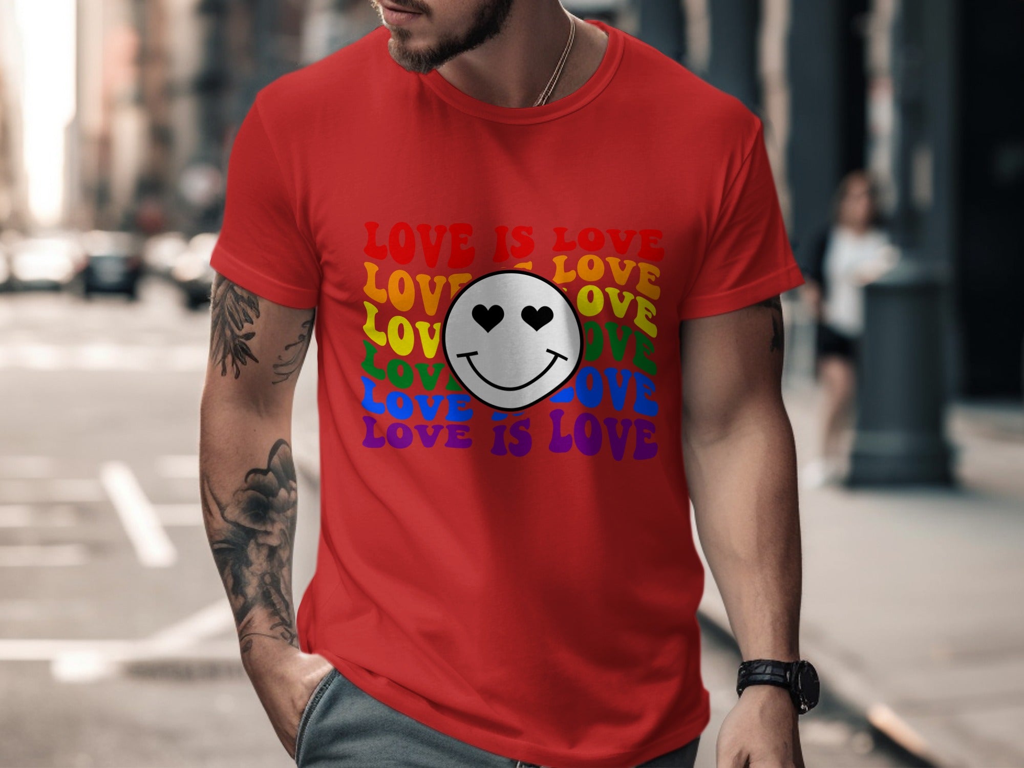 Red t-shirt with rainbow gradient "LOVE IS LOVE" text and smiley face with heart eyes.