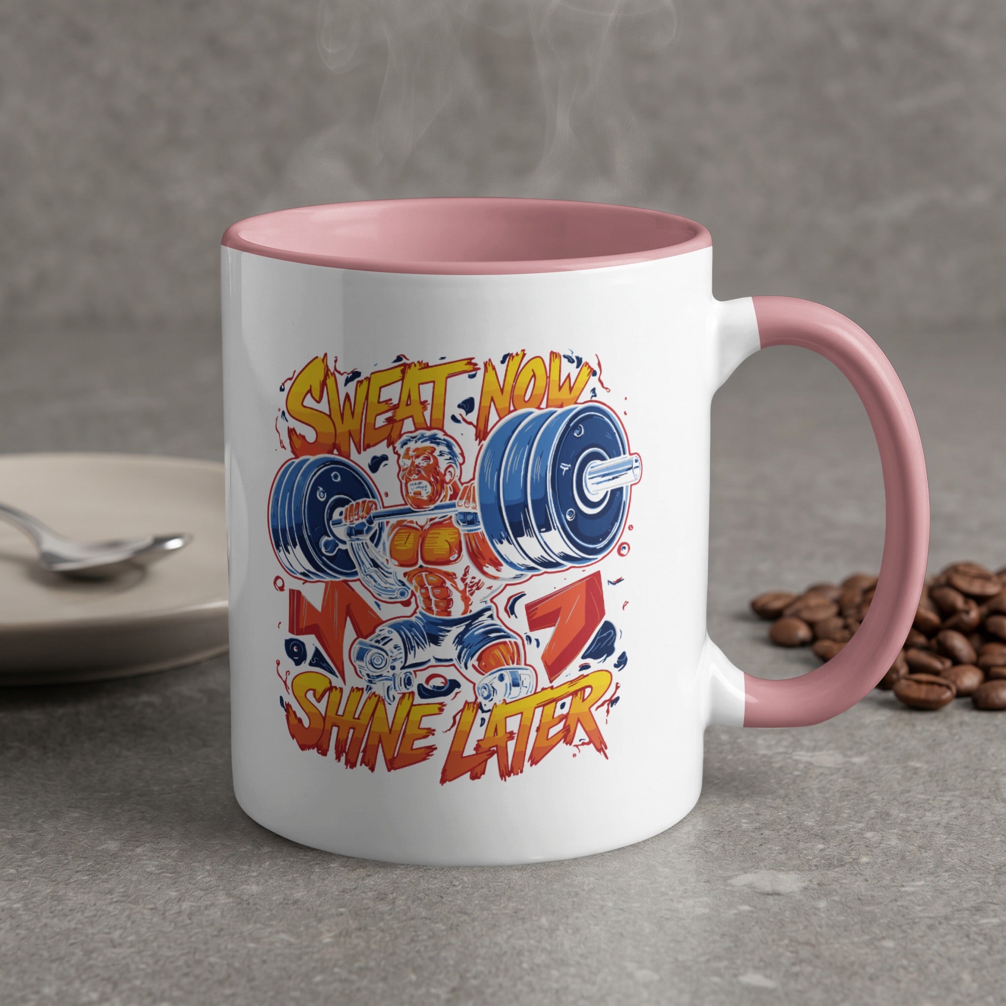 White mug with pink handle, featuring bodybuilding graphic and text.