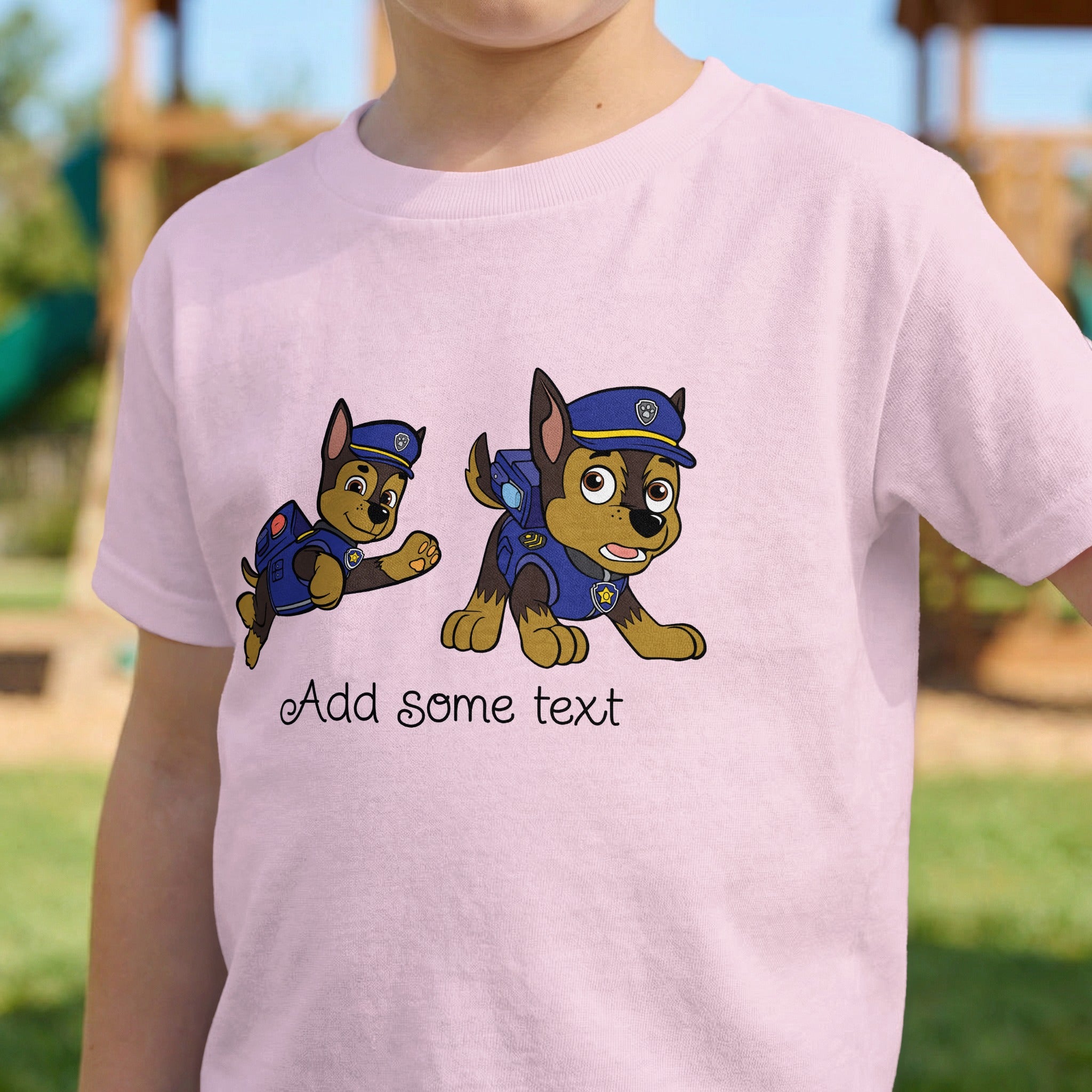 Pink t-shirt with cartoon police dogs and text placeholder.