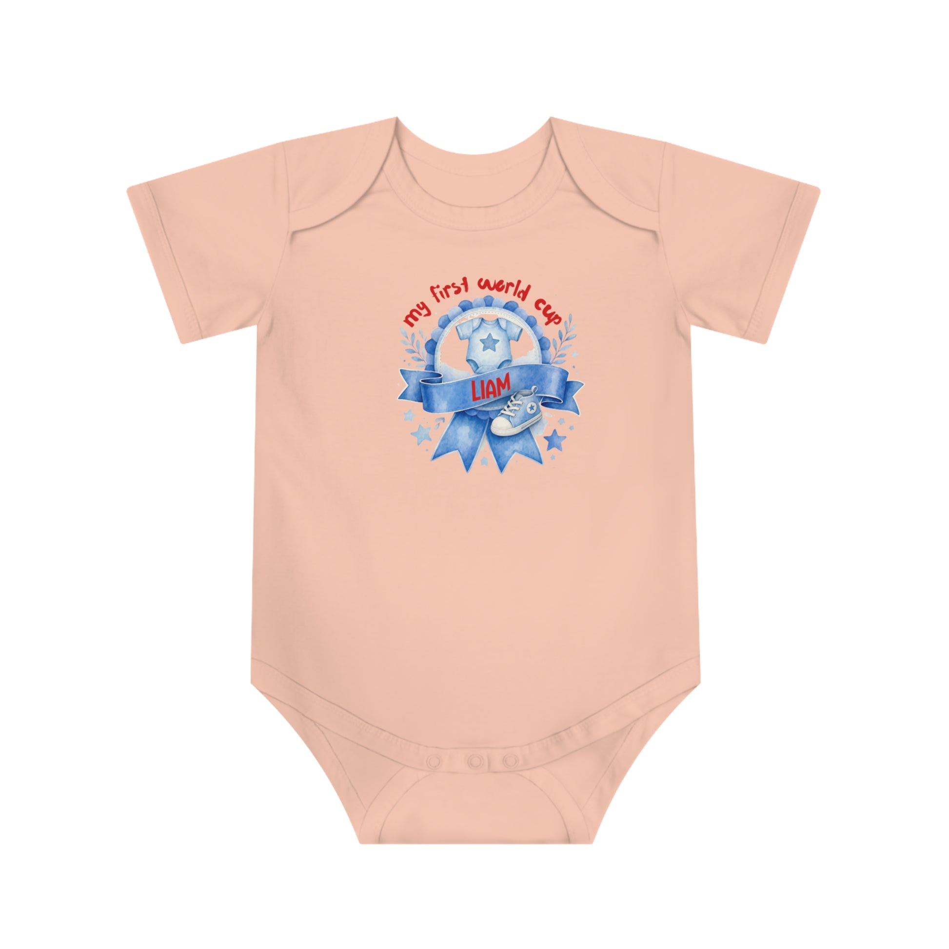 Baby onesie with "my first world cup" text, trophy, and sneakers graphic.
