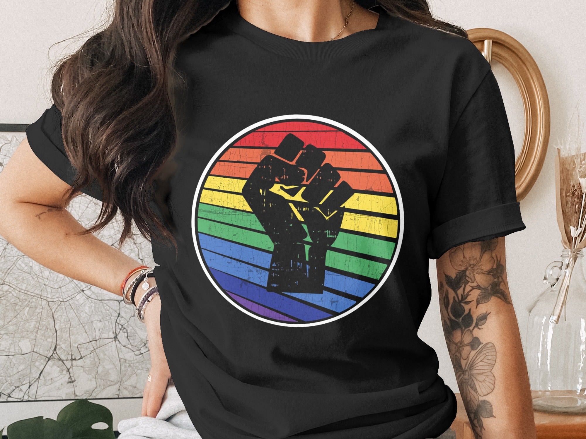 Black t-shirt with a distressed rainbow circle and raised fist graphic.