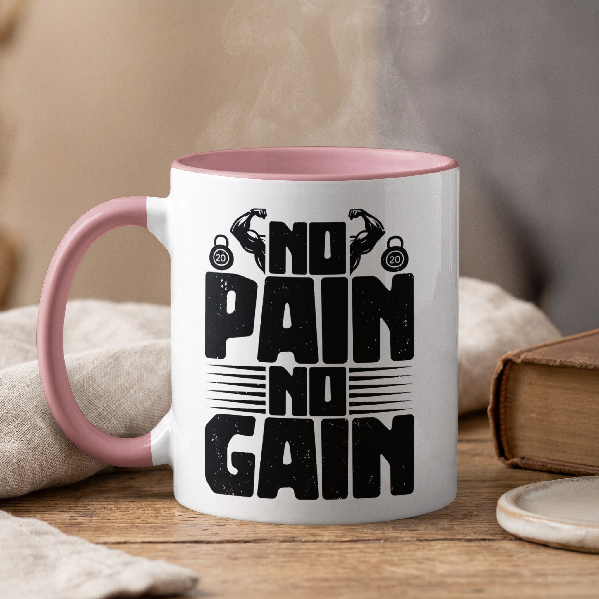 White mug with pink handle, "NO PAIN NO GAIN" text and dumbbells.