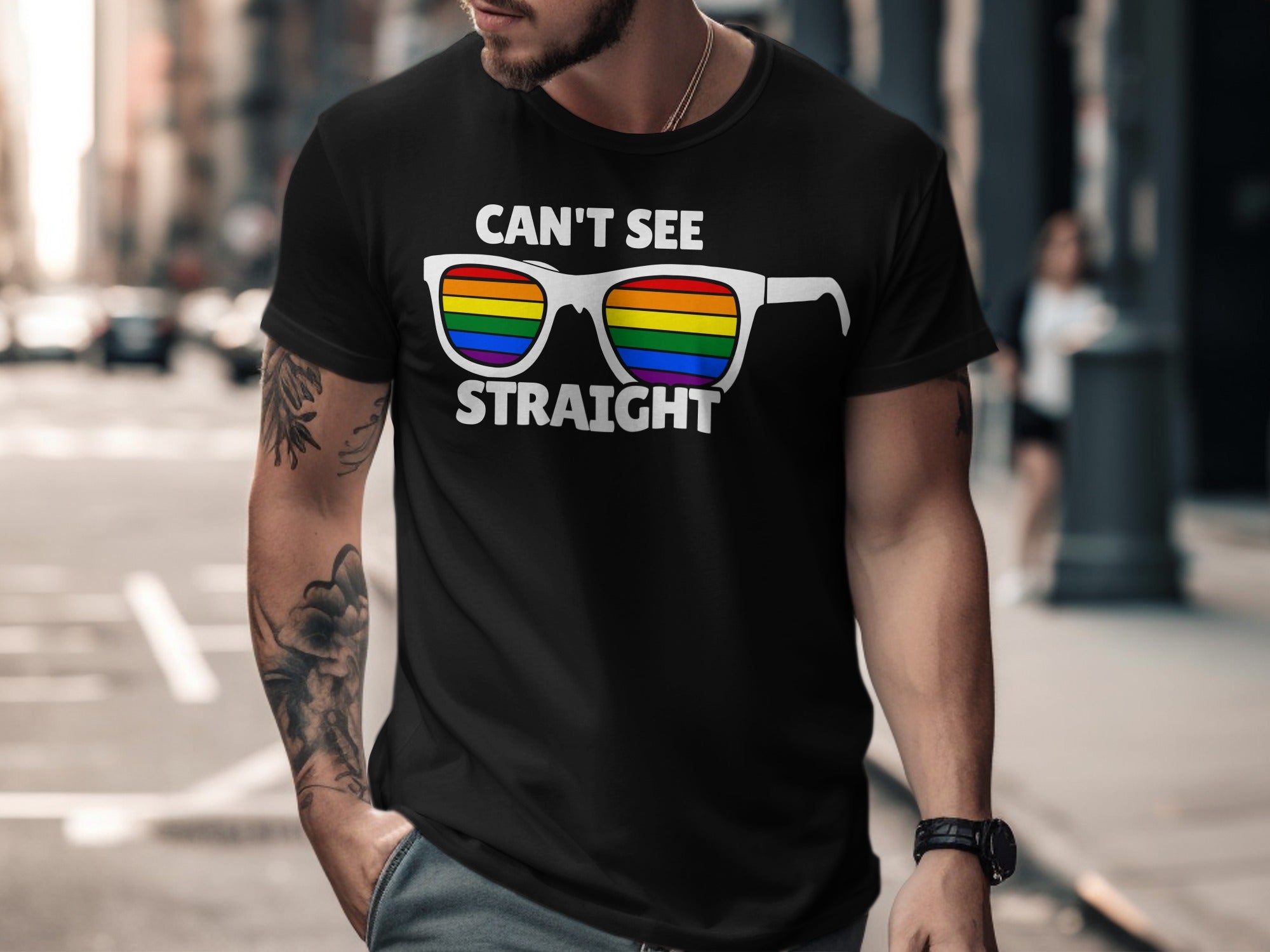 Black t-shirt with white text "CAN'T SEE STRAIGHT" over rainbow sunglasses.