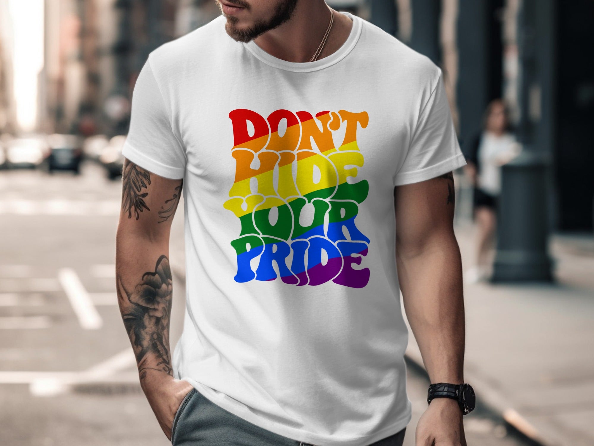 White t-shirt with rainbow text reading "Don't Hide Your Pride"