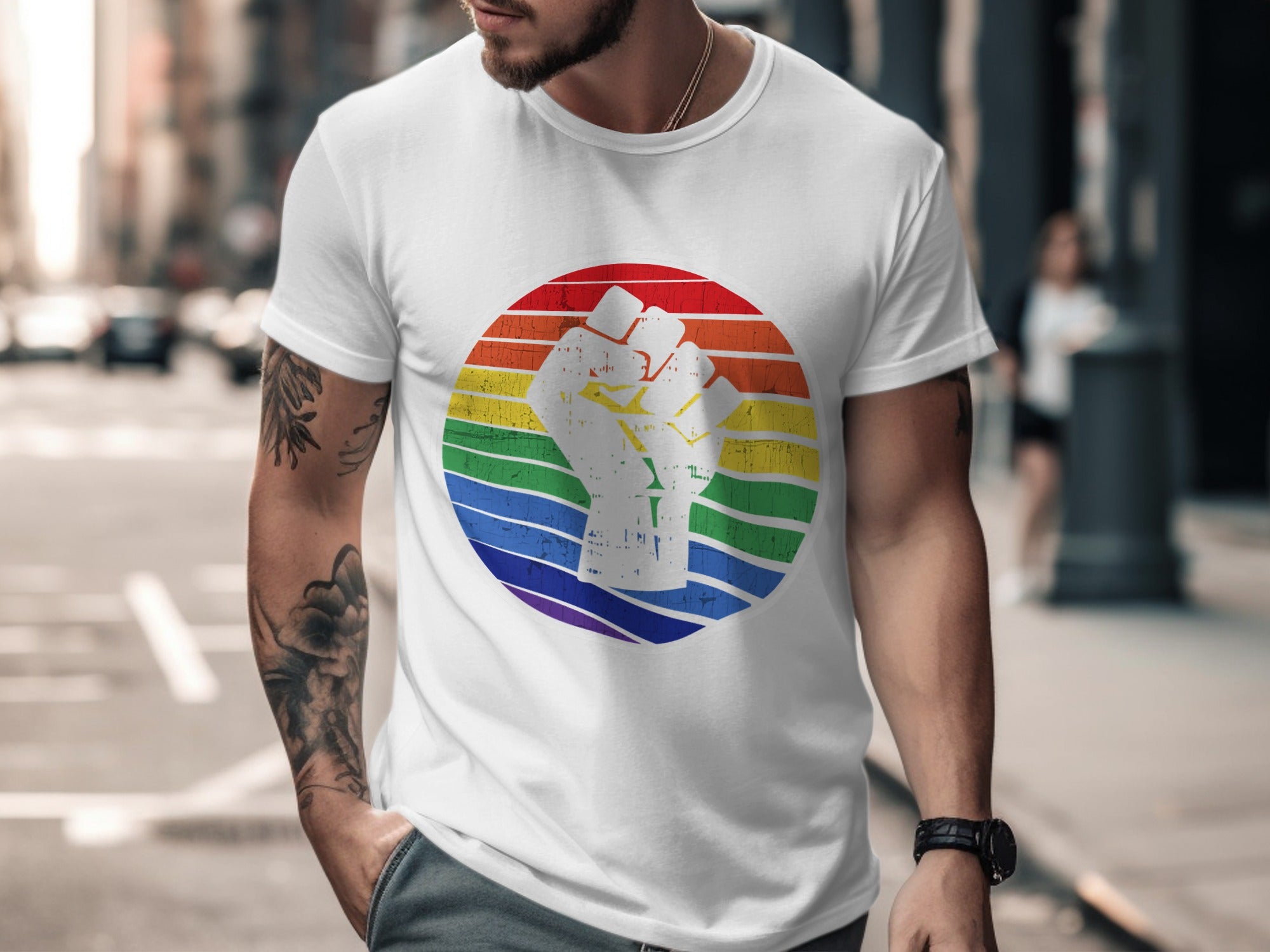 White t-shirt with rainbow circle and raised fist graphic.