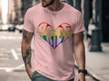 Pink t-shirt with a rainbow heart design spelling "PRIDE" on the front.