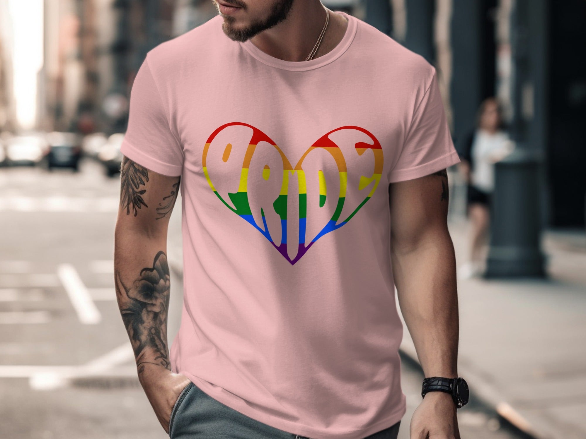 Pink t-shirt with a rainbow heart design spelling "PRIDE" on the front.