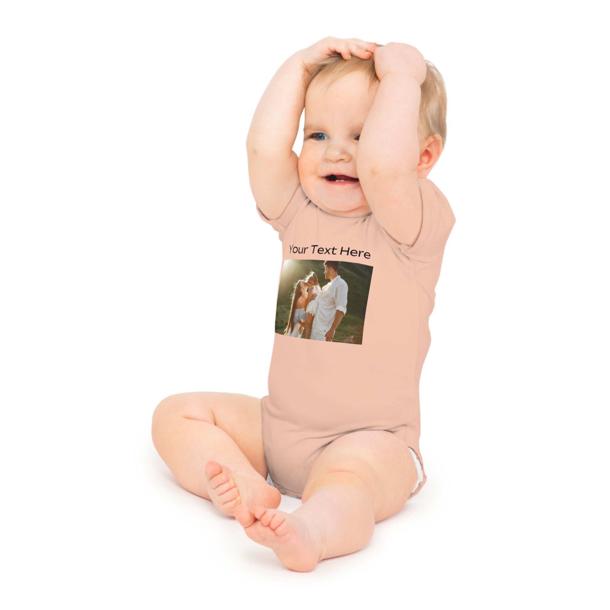 Baby wearing peach-colored onesie with "Your Text Here" and family photo.