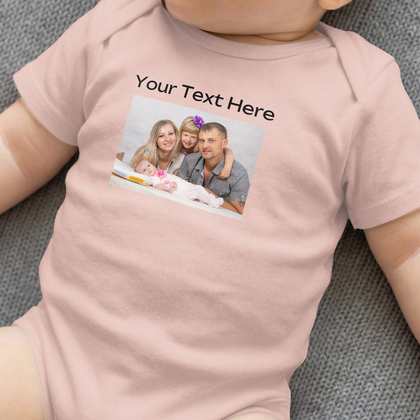 Pink baby onesie customized with a family photo and "Your Text Here."