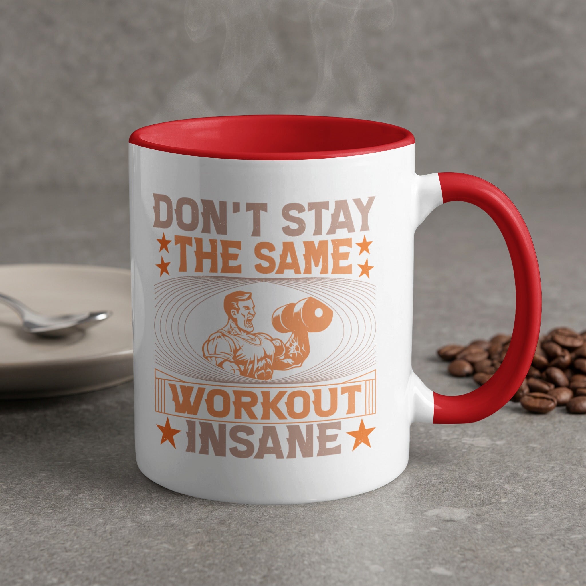 White mug with red handle, featuring "Don't Stay the Same Workout Insane" text and muscular figure graphic.