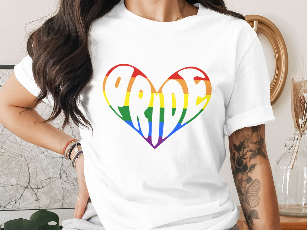 White t-shirt with rainbow heart graphic spelling "Pride".