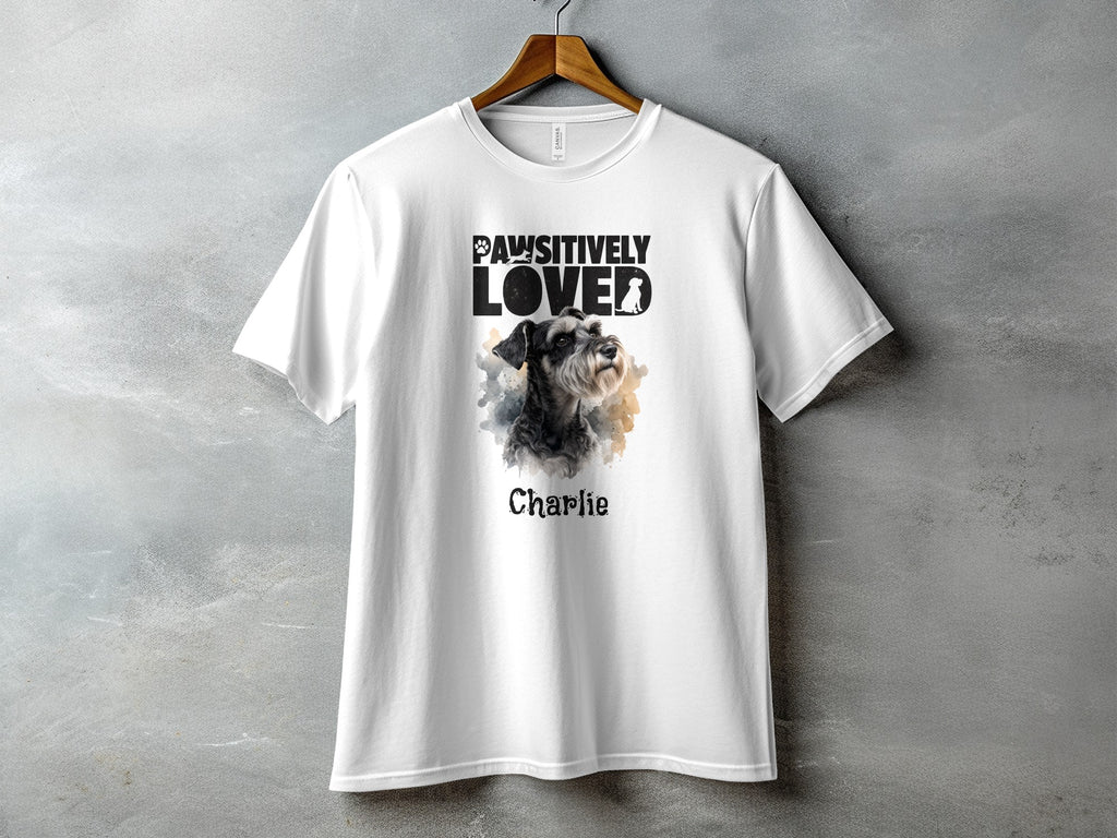 White t-shirt with "Pawsitively Loved" text and a schnauzer dog portrait named Charlie.