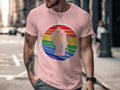 Pink t-shirt with a stylized raised fist on a rainbow background.