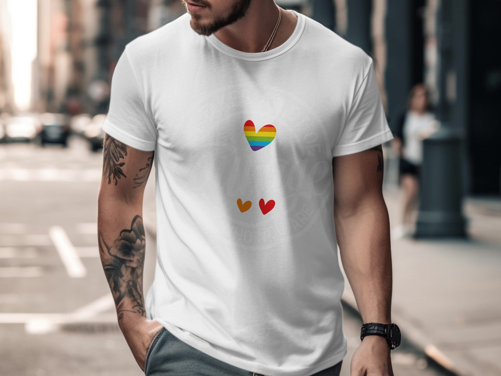 White t-shirt with rainbow heart and two smaller hearts below.