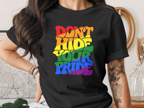 Black t-shirt with "Don't Hide Your Pride" text in rainbow colors.