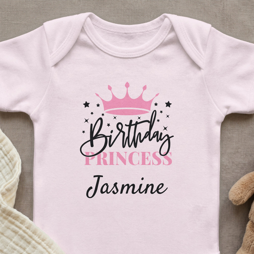 Pink baby onesie with "Birthday Princess Jasmine" and a crown design.