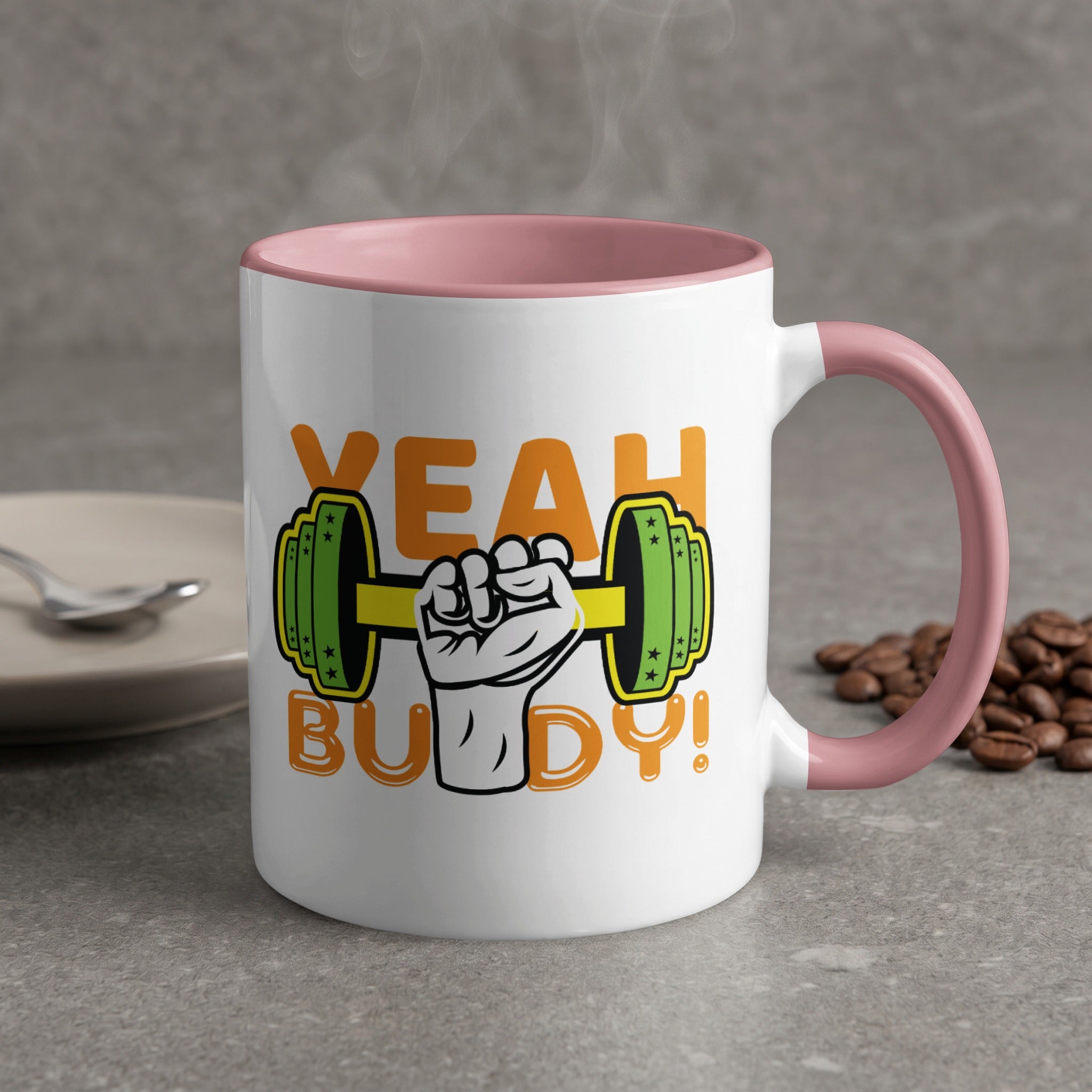 Mug with "YEAH BUDDY!" text and a dumbbell graphic, pink rim.