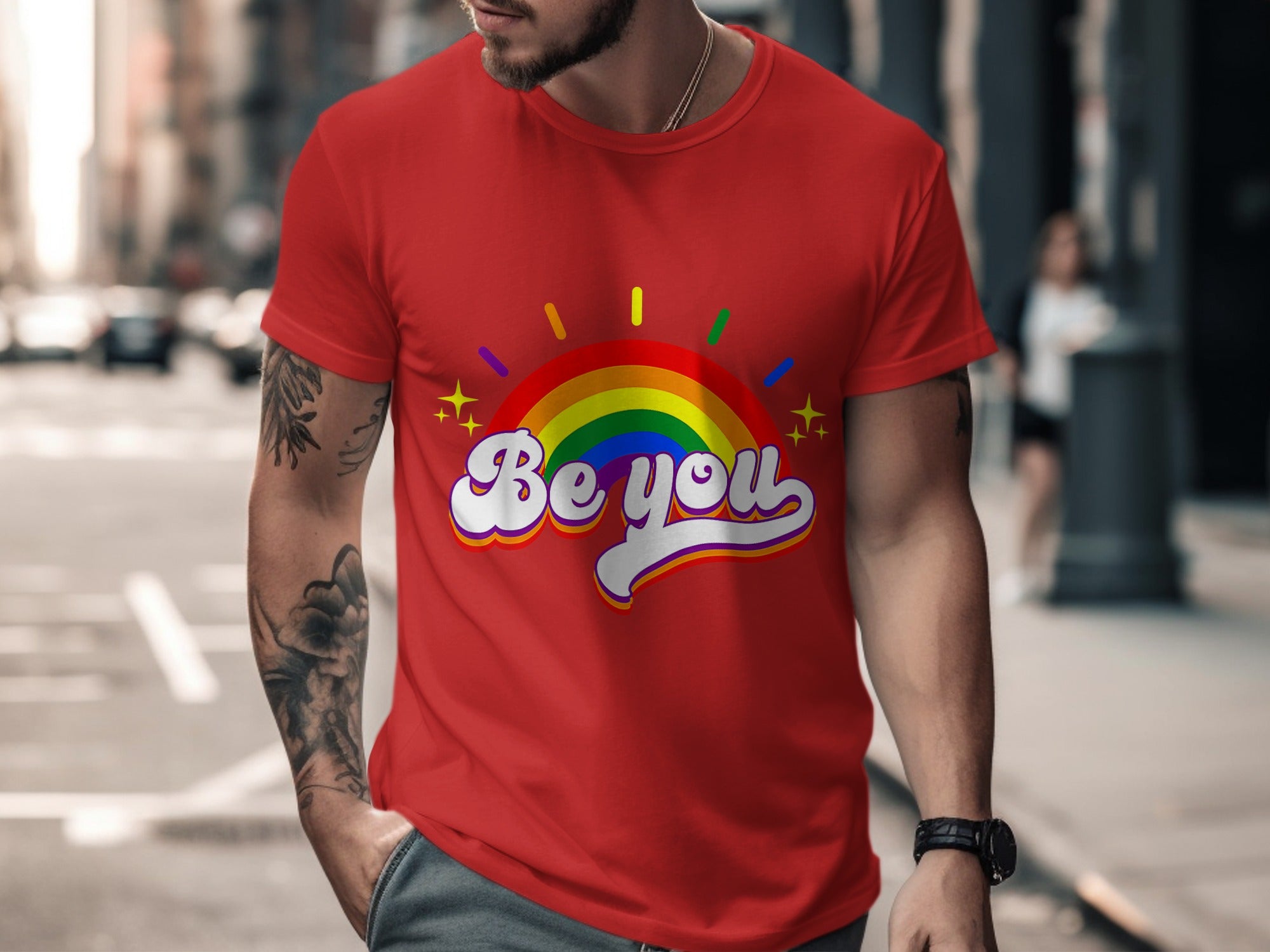 Red t-shirt with "Be you" in rainbow lettering and sunburst graphic.