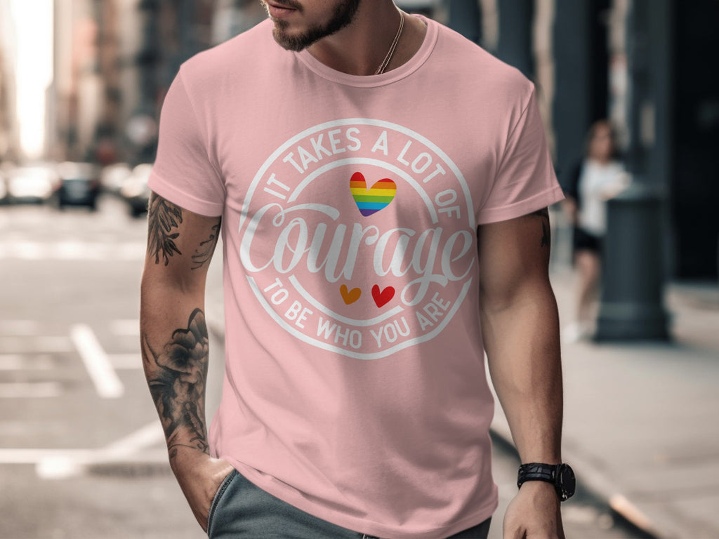 Pink t-shirt with "It Takes a Lot of Courage To Be Who You Are" text and rainbow heart.