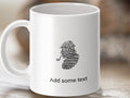 White mug with seahorse design made of words, "Add some text" below.