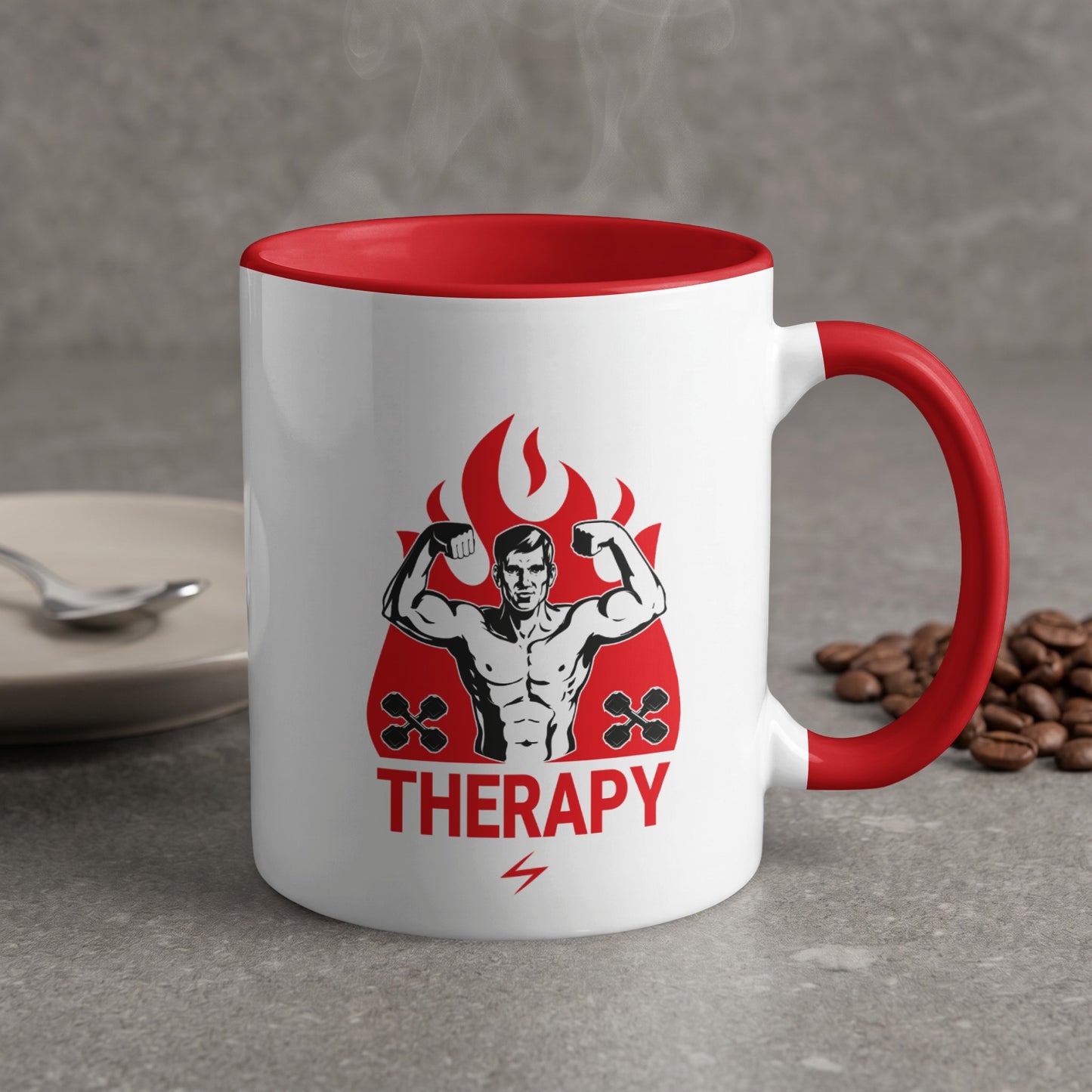 White mug with red rim and handle featuring a flexing man graphic and "THERAPY".