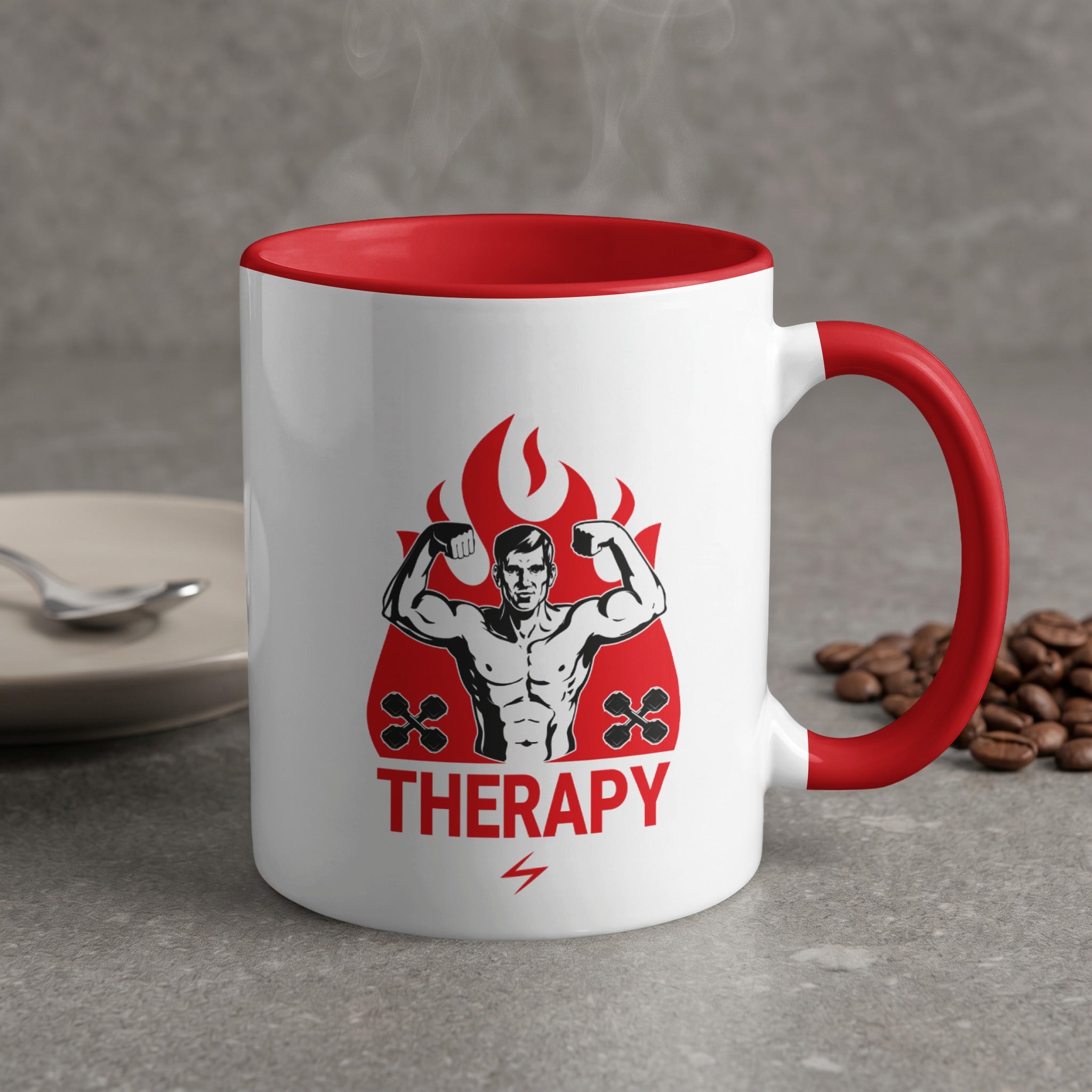 White mug with red rim and handle featuring a flexing man graphic and "THERAPY".