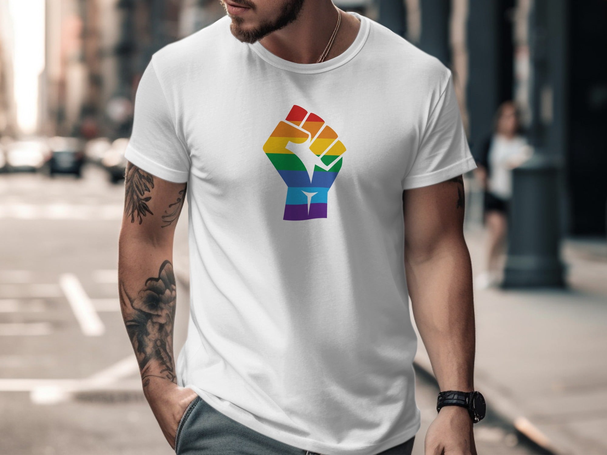 White t-shirt with rainbow fist graphic on chest.