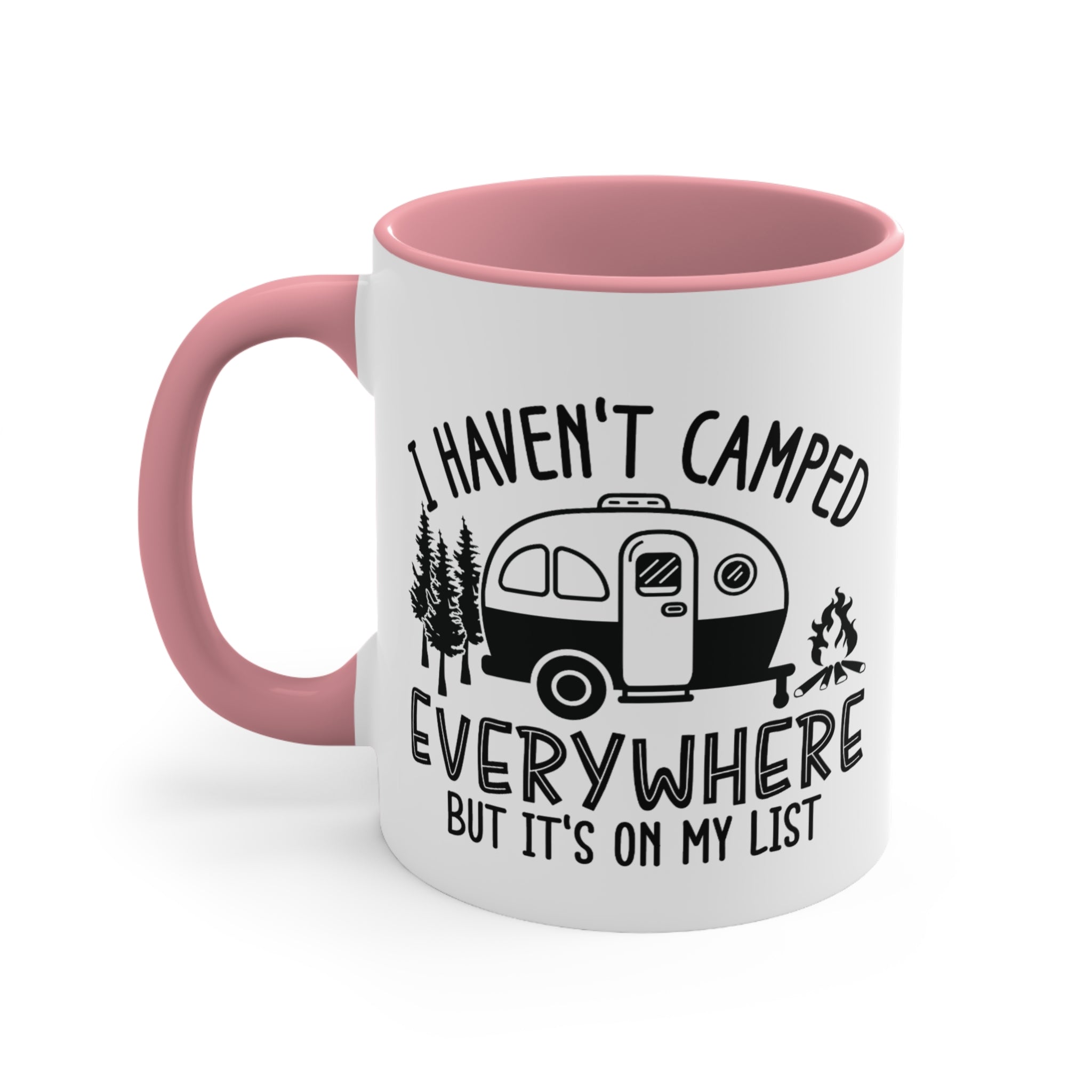 White mug with pink handle and interior, featuring a camper and trees with text.