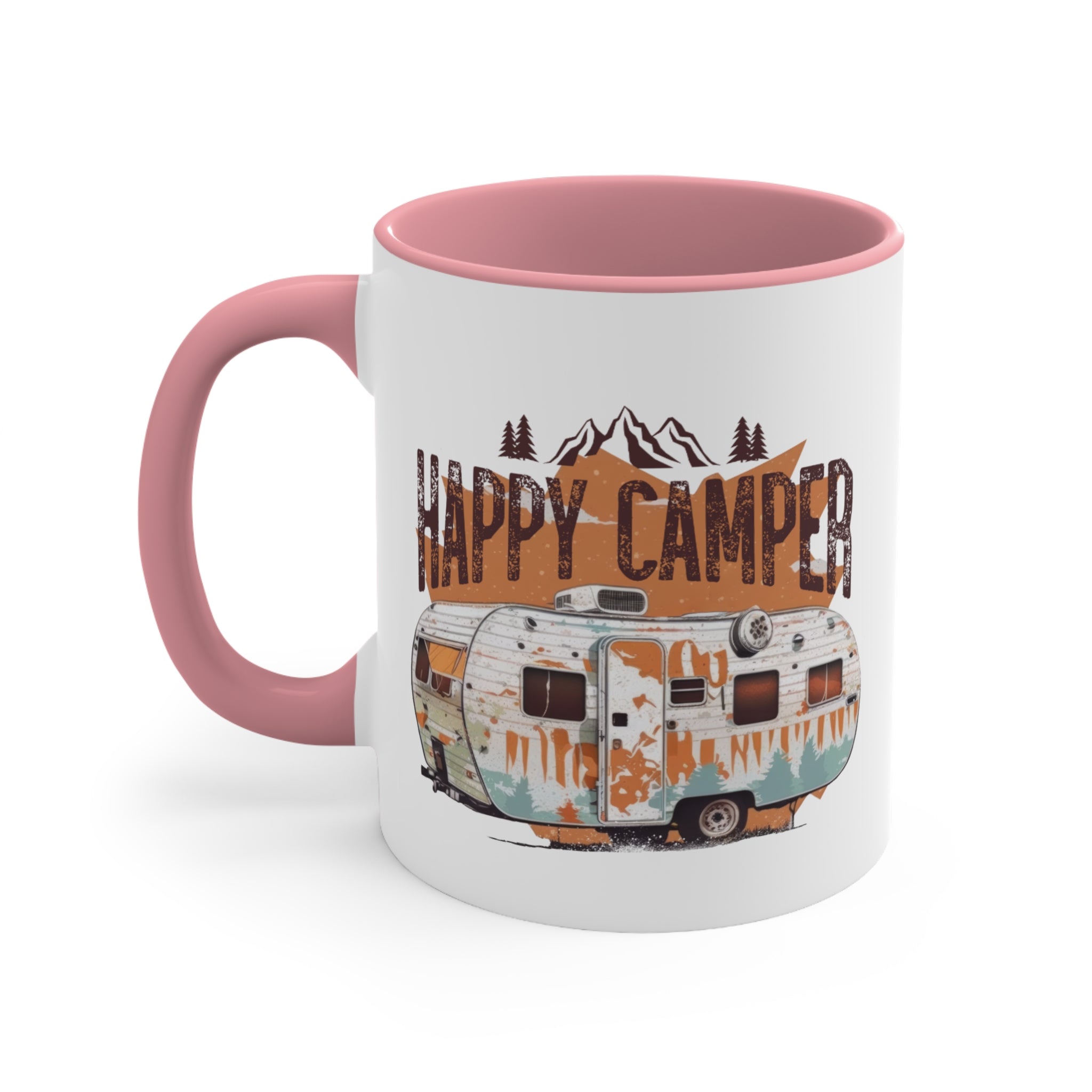 White mug with pink handle featuring a distressed vintage camper and mountains with "Happy Camper" text.