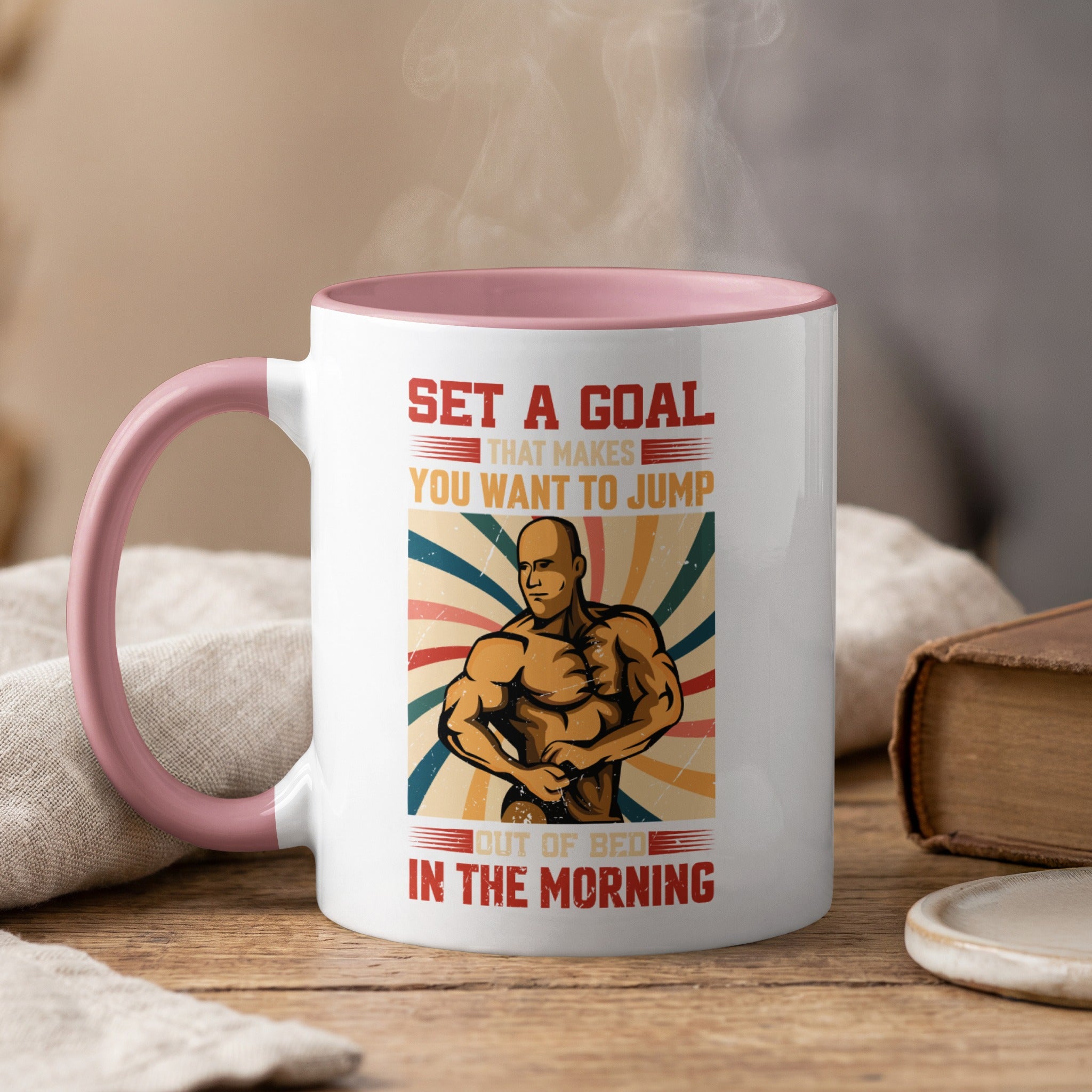 Mug with bodybuilder and motivational text "Set a goal that makes you want to jump out of bed in the morning."