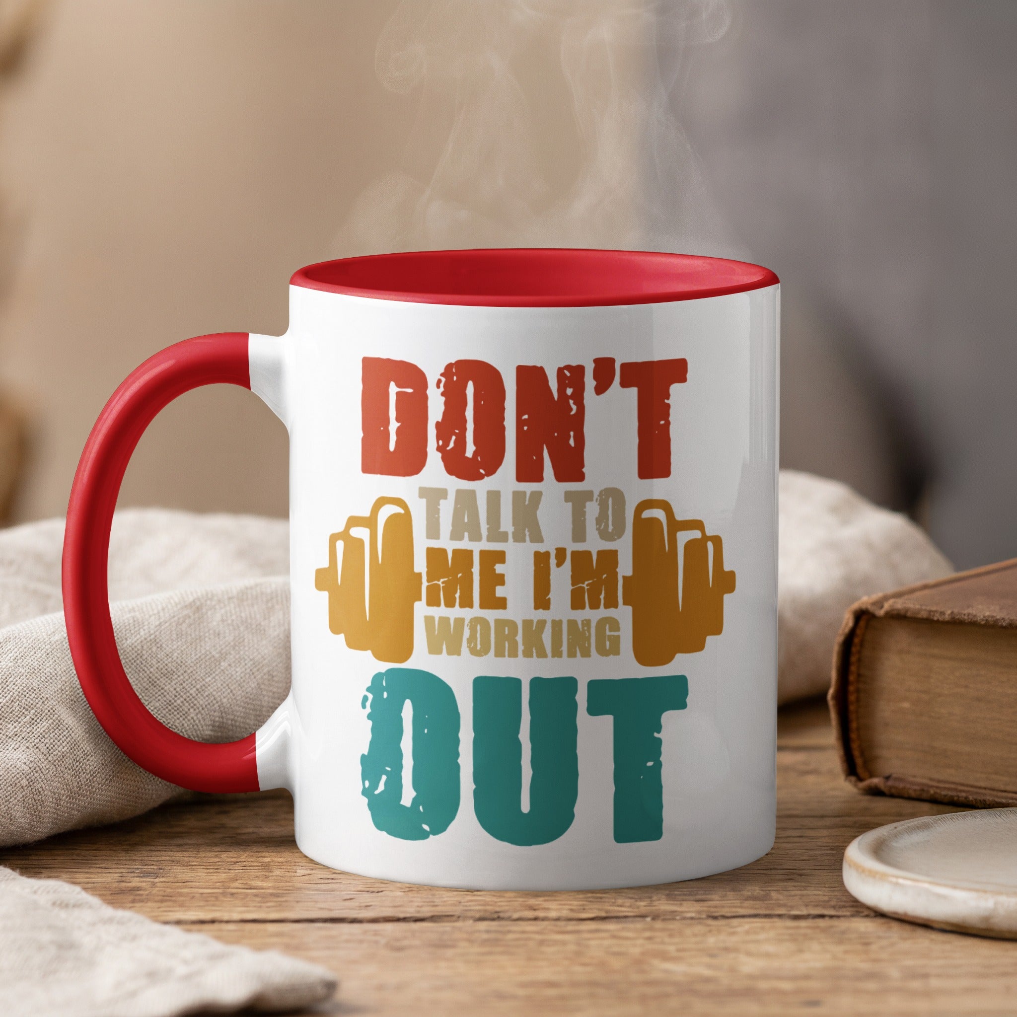White mug with red rim, features text "Don't talk to me I'm working out".