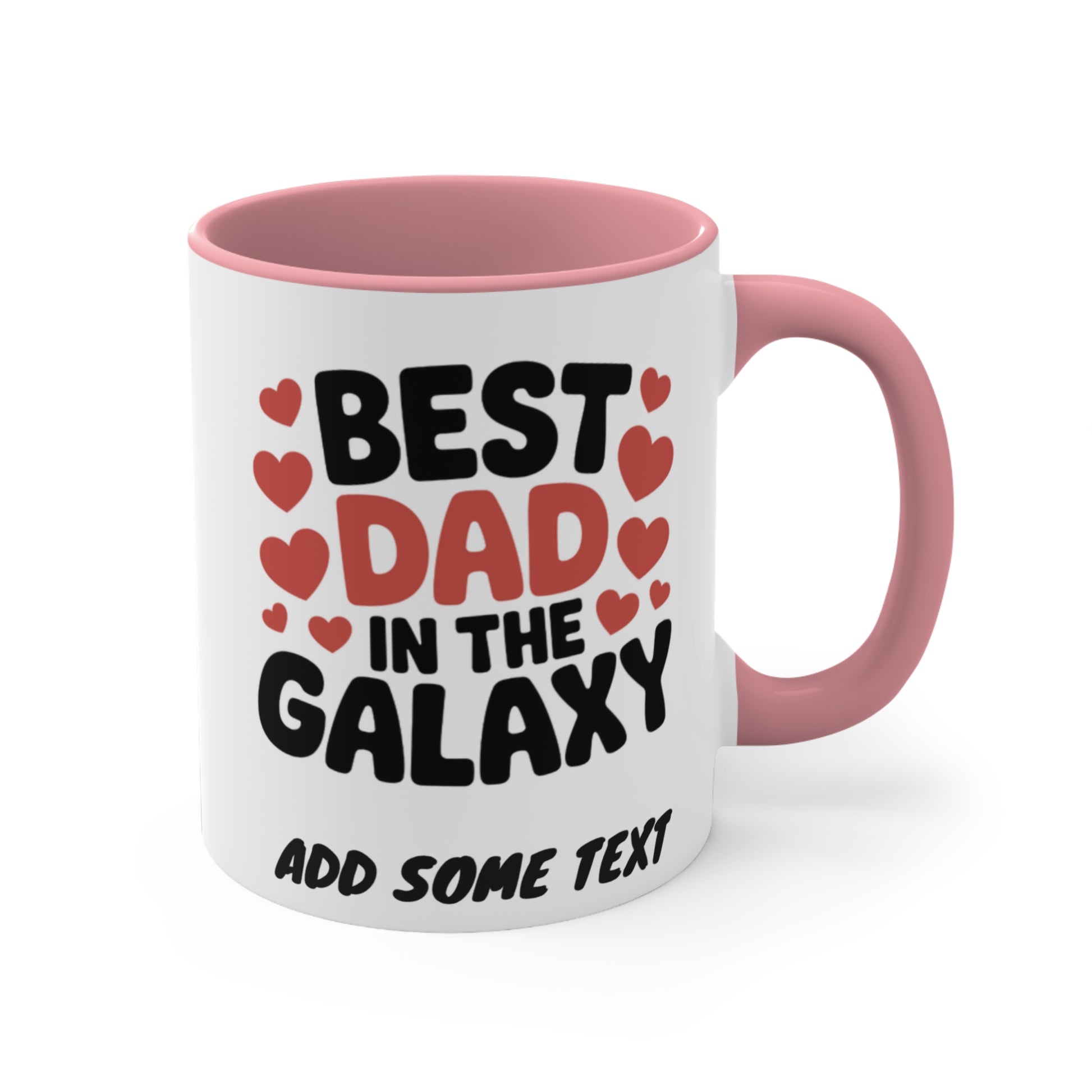 White mug with pink handle, "BEST DAD IN THE GALAXY" text and hearts.