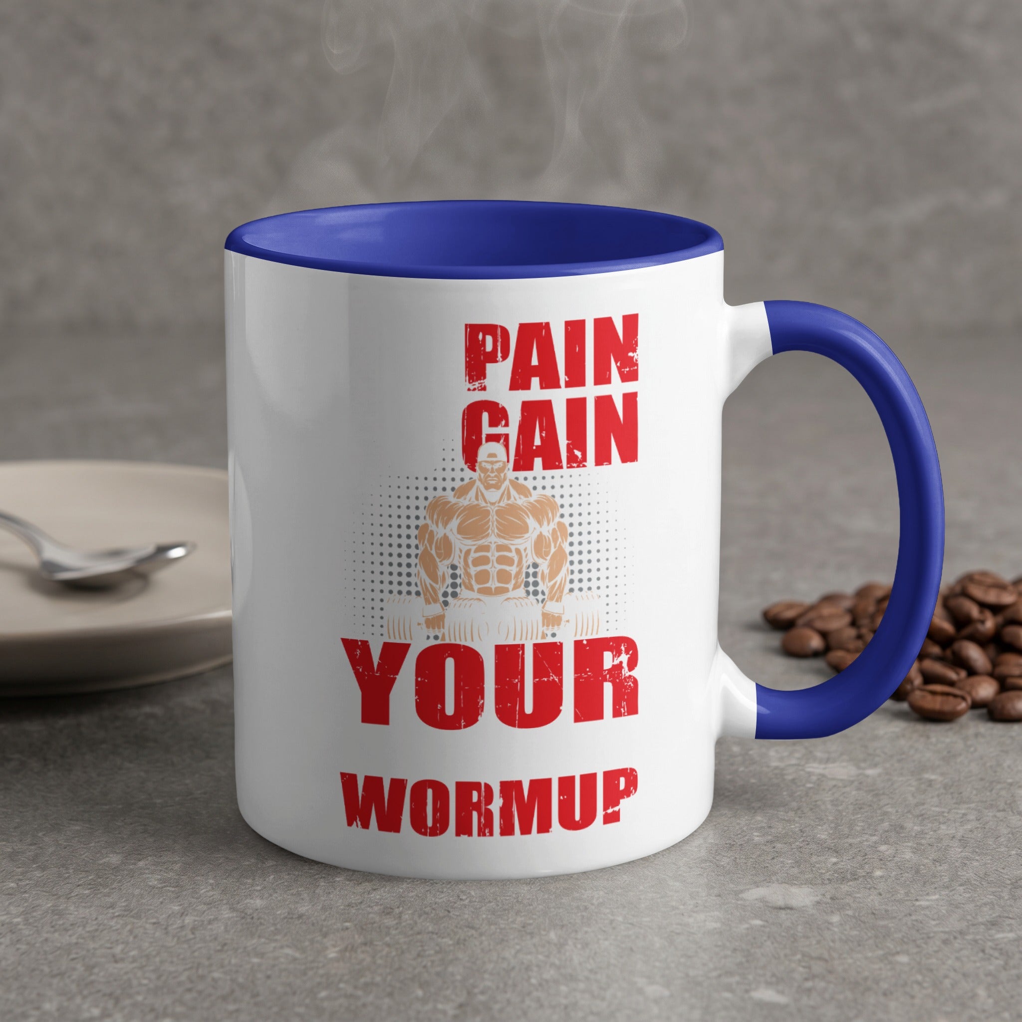 White mug with blue handle, "Pain Gain Your Warmup" text, and muscular man graphic.