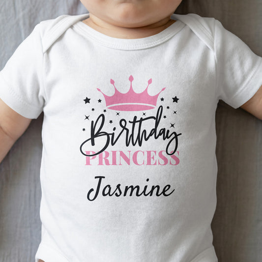 White baby onesie with pink crown and text "Birthday Princess Jasmine".