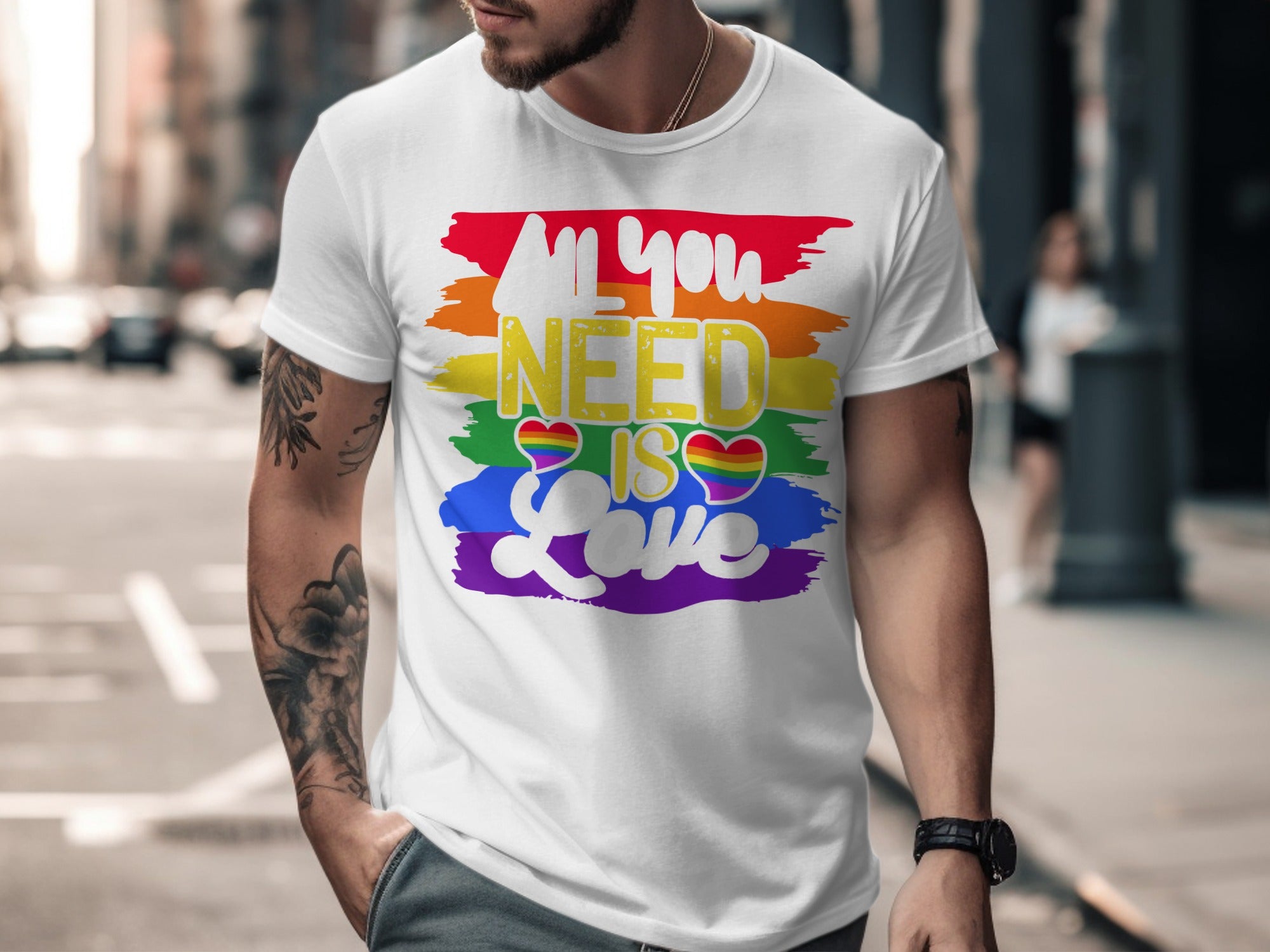 White t-shirt with rainbow stripes and text "All you NEED IS Love".