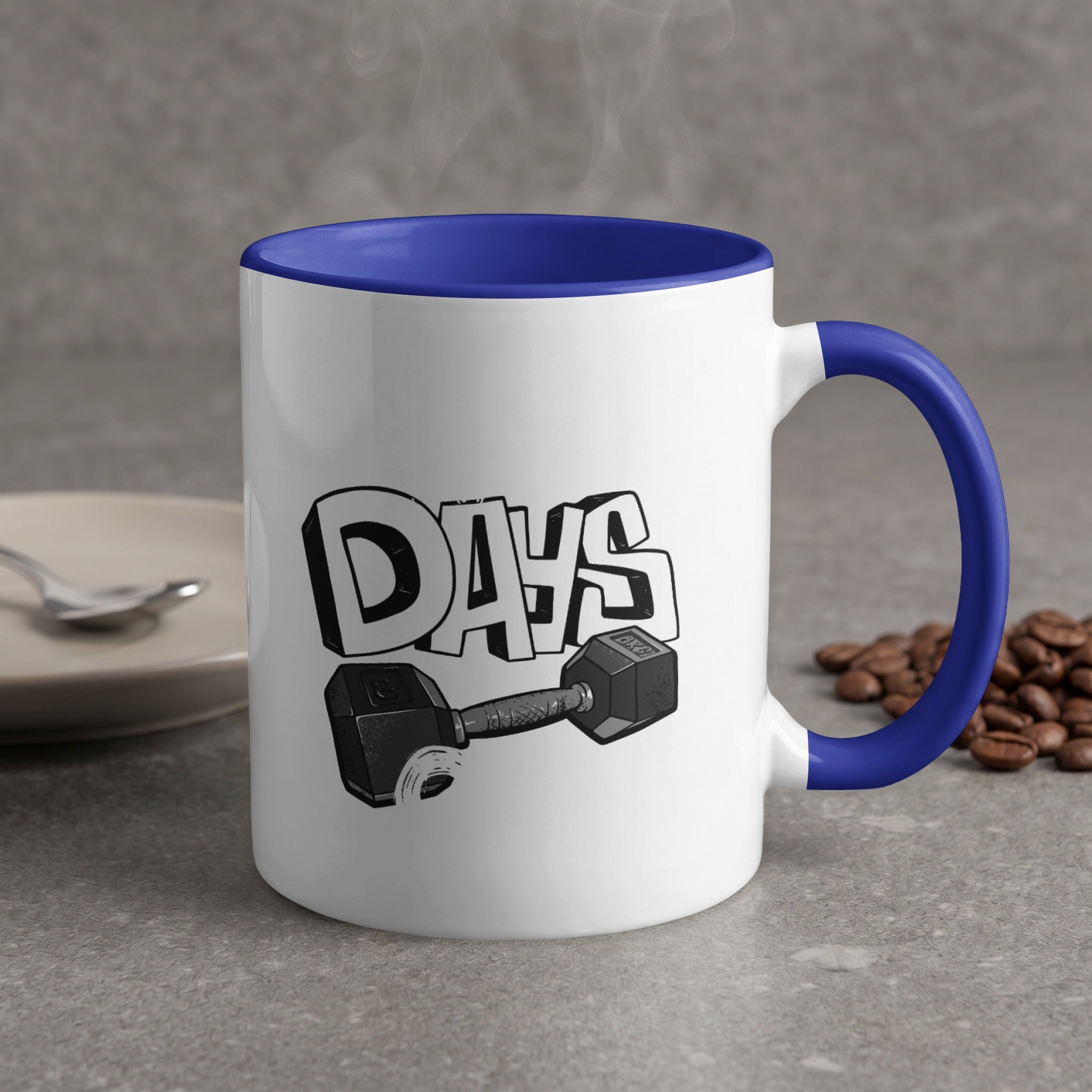 White mug with blue handle, "DAYS" text, and dumbbell graphic.