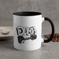 White mug with black rim, "DAYS" text and dumbbell graphic, coffee beans.
