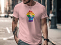 Pink t-shirt with a rainbow fist symbol on the chest.