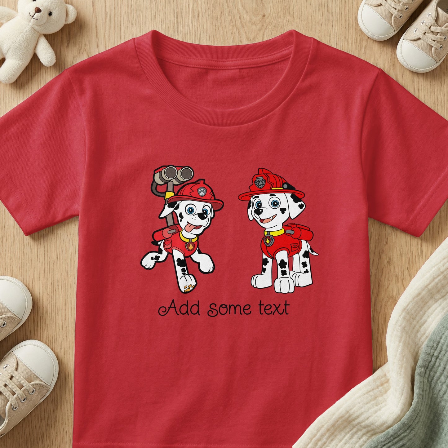 Red t-shirt with two dalmatians in firefighter gear and text.