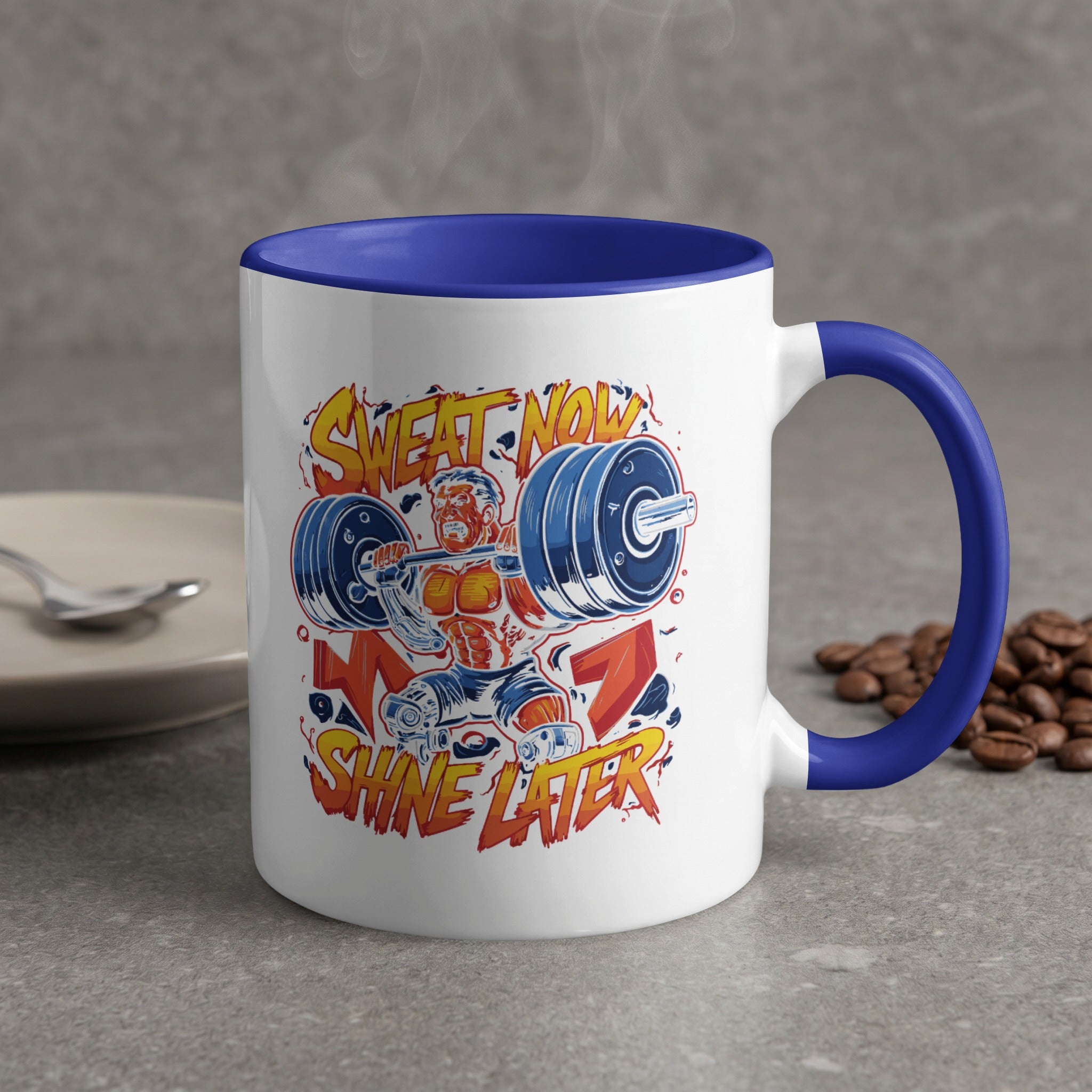 Mug with "Sweat Now Shine Later" barbell workout graphic and coffee beans.