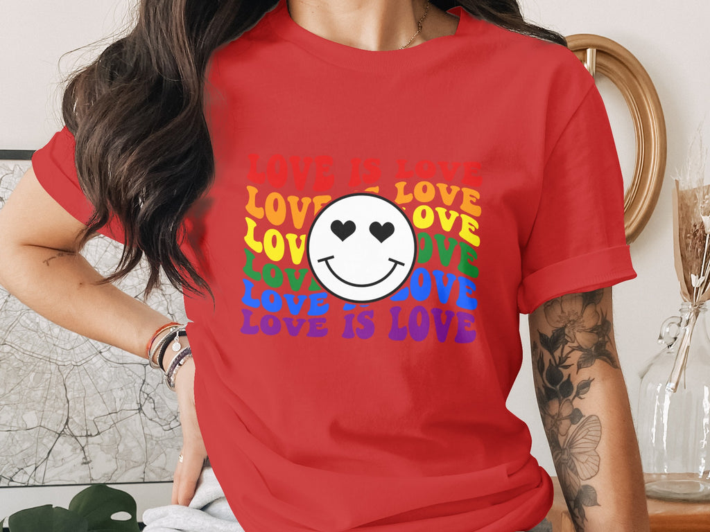Red t-shirt with smiley face and "LOVE IS LOVE" in rainbow colors.