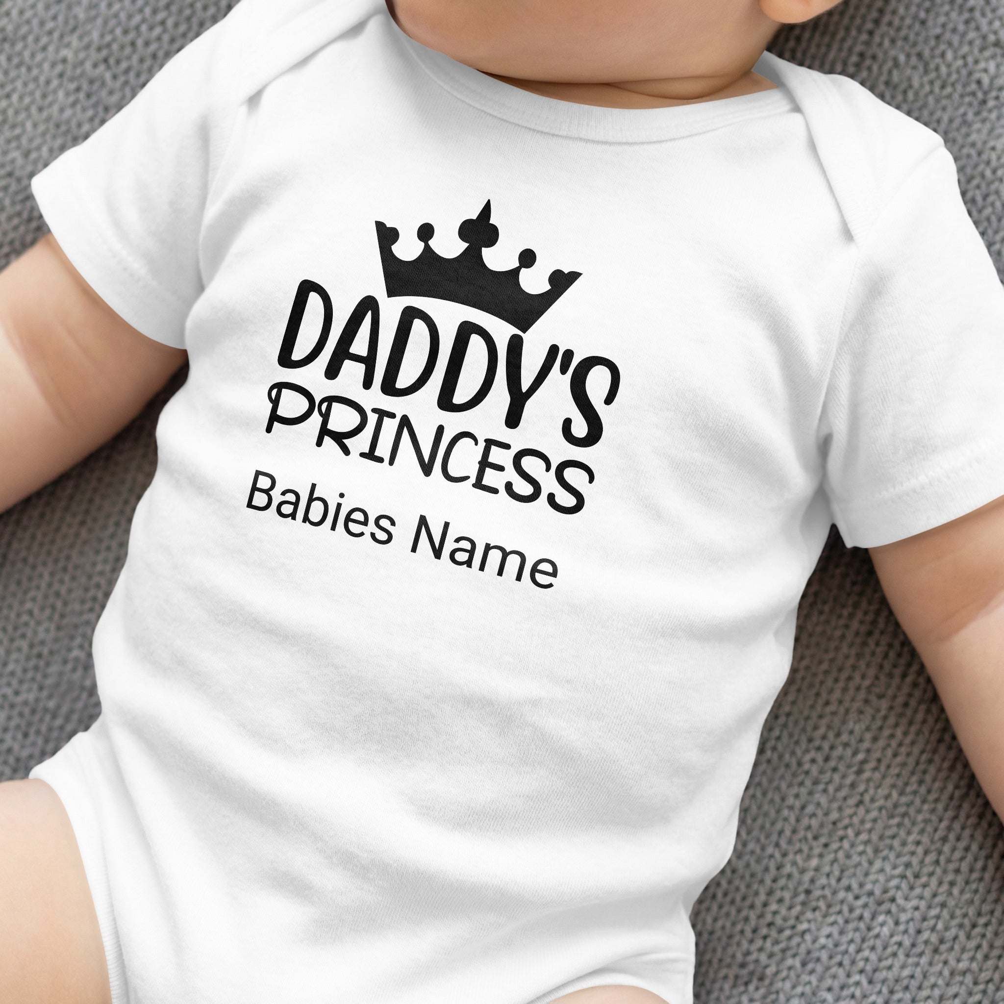 White baby onesie with "Daddy's PRINCESS" and "Babies Name" text.