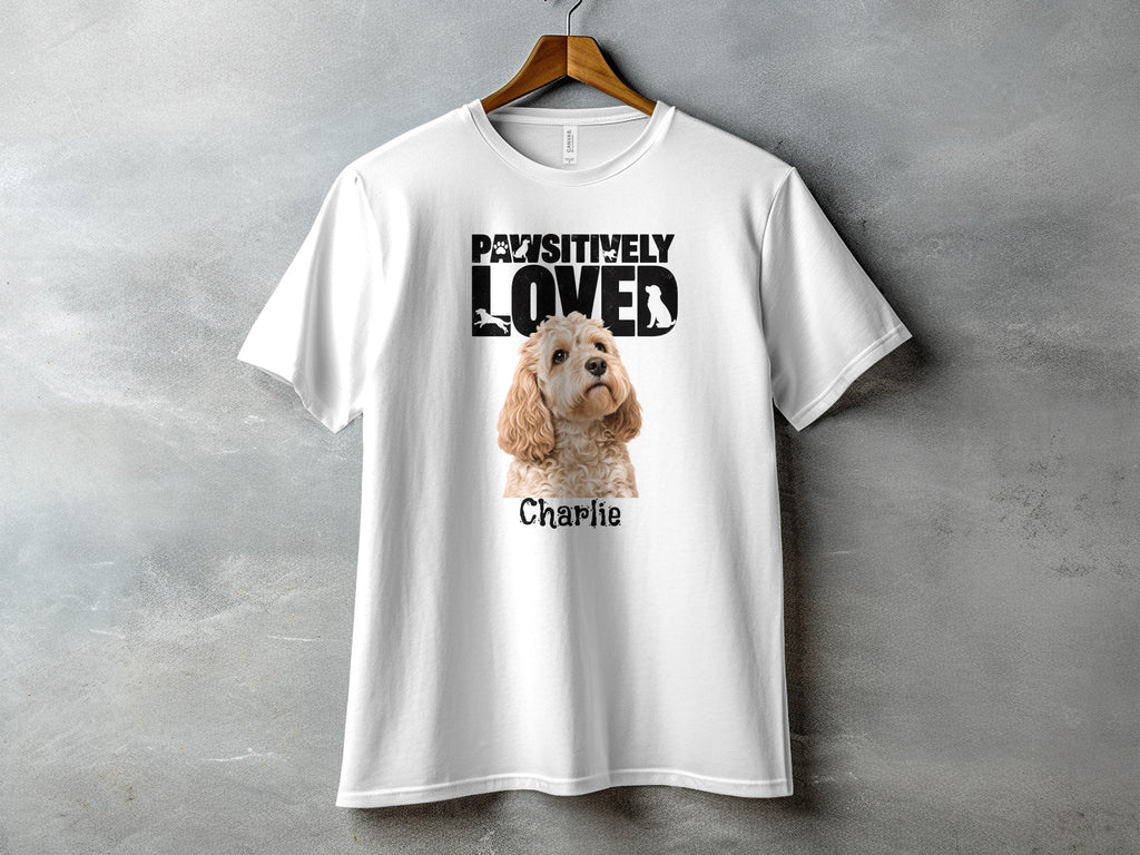 White t-shirt with "Pawsitively Loved" text and a dog named Charlie.