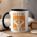 White mug with orange gym silhouette and text "MEET ME THE GYM".